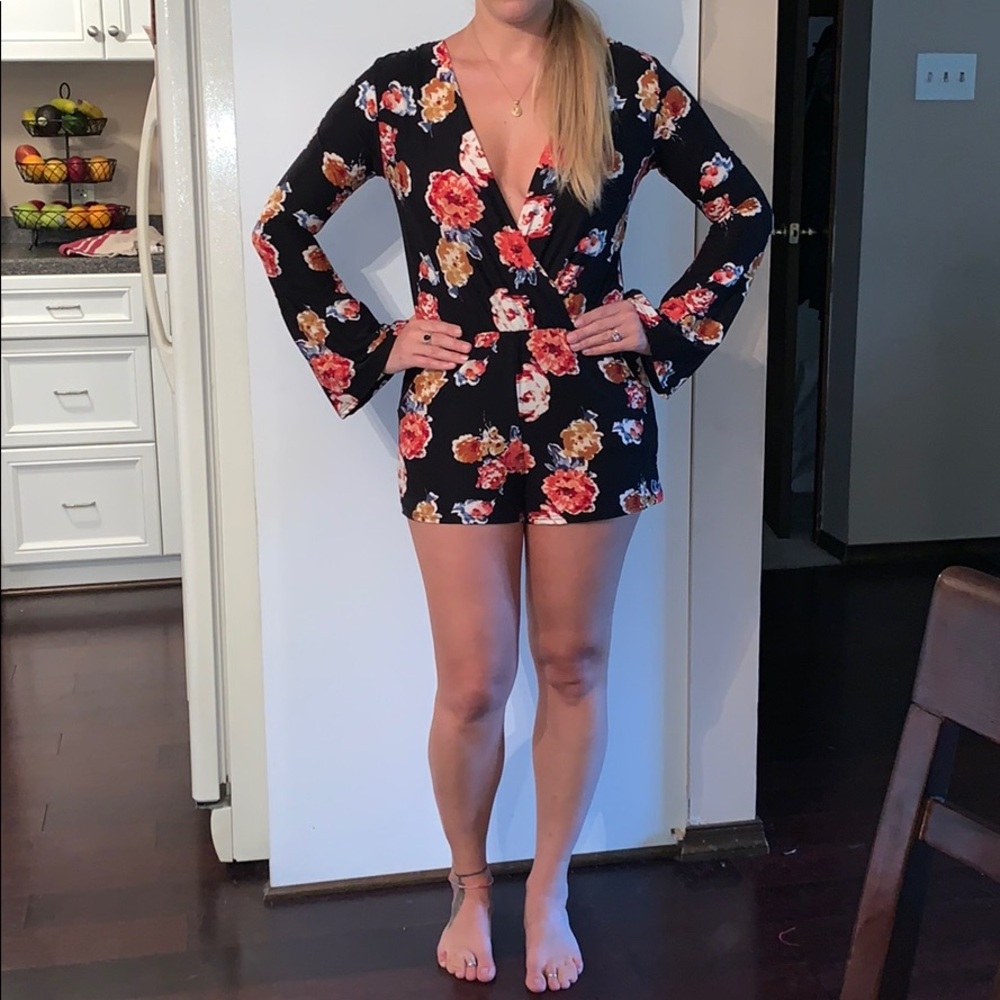 Black floral romper worn once!!